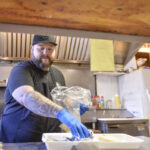 A man prepares a meal